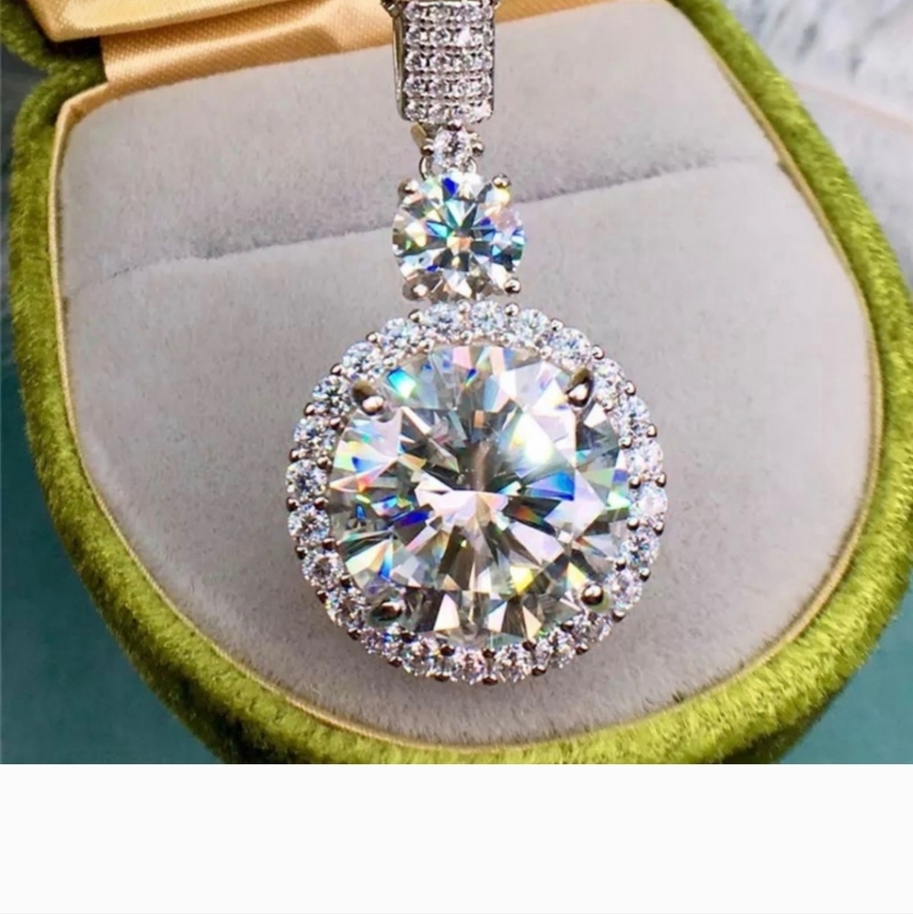 Center stone: Genuine 10 carats Moissanite and 1 carat Moissanite-smaller stones